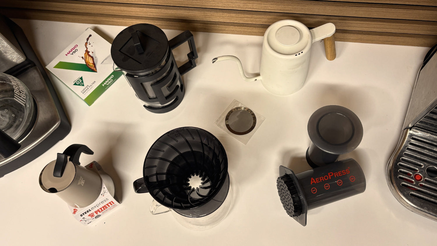 Collection of coffee-making equipment on a kitchen counter