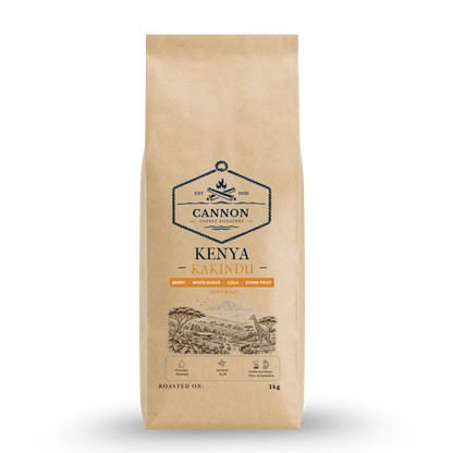 A 1kg bag of Cannon Central Estate Kenya Kakindu coffee on a white background. The packaging is a natural kraft paper bag with a blue and orange logo and illustration.