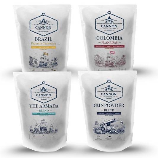 Four stand-up pouches of Cannon coffee blends arranged in a 2x2 grid on a white background. The pouches are labeled Brazil, Colombia, The Armada Blend, and Gunpowder Blend, with vintage-style illustrations on the front.
